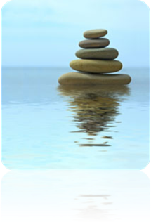 Tower of rocks over calm water